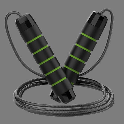 Black and green jump rope on a gray background