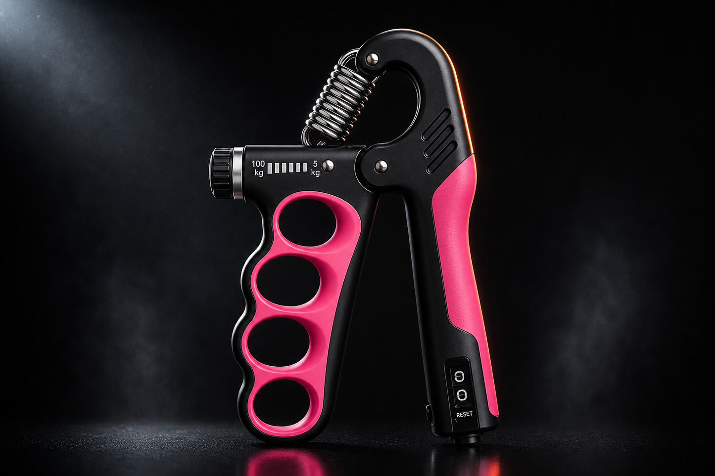 X-Grip Pro adjustable hand strengthener in pink, 5 to 100 kg dial-adjustable resistance, dark studio hero shot