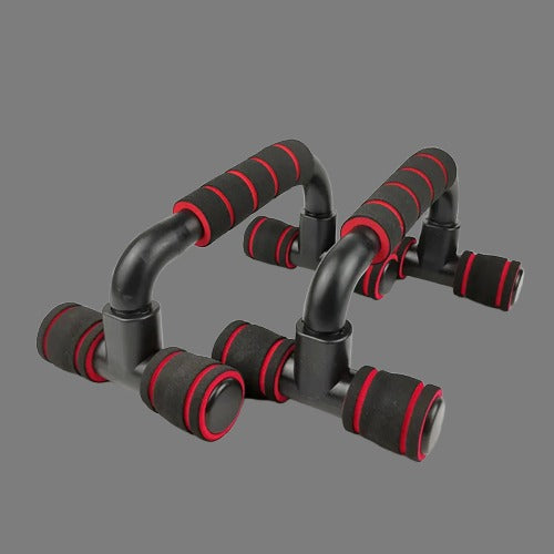 Black and red exercise push-up handles on a gray background