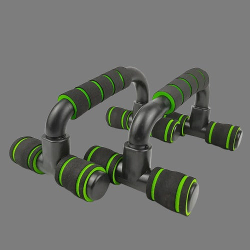 Black and green exercise push-up handles on a gray background