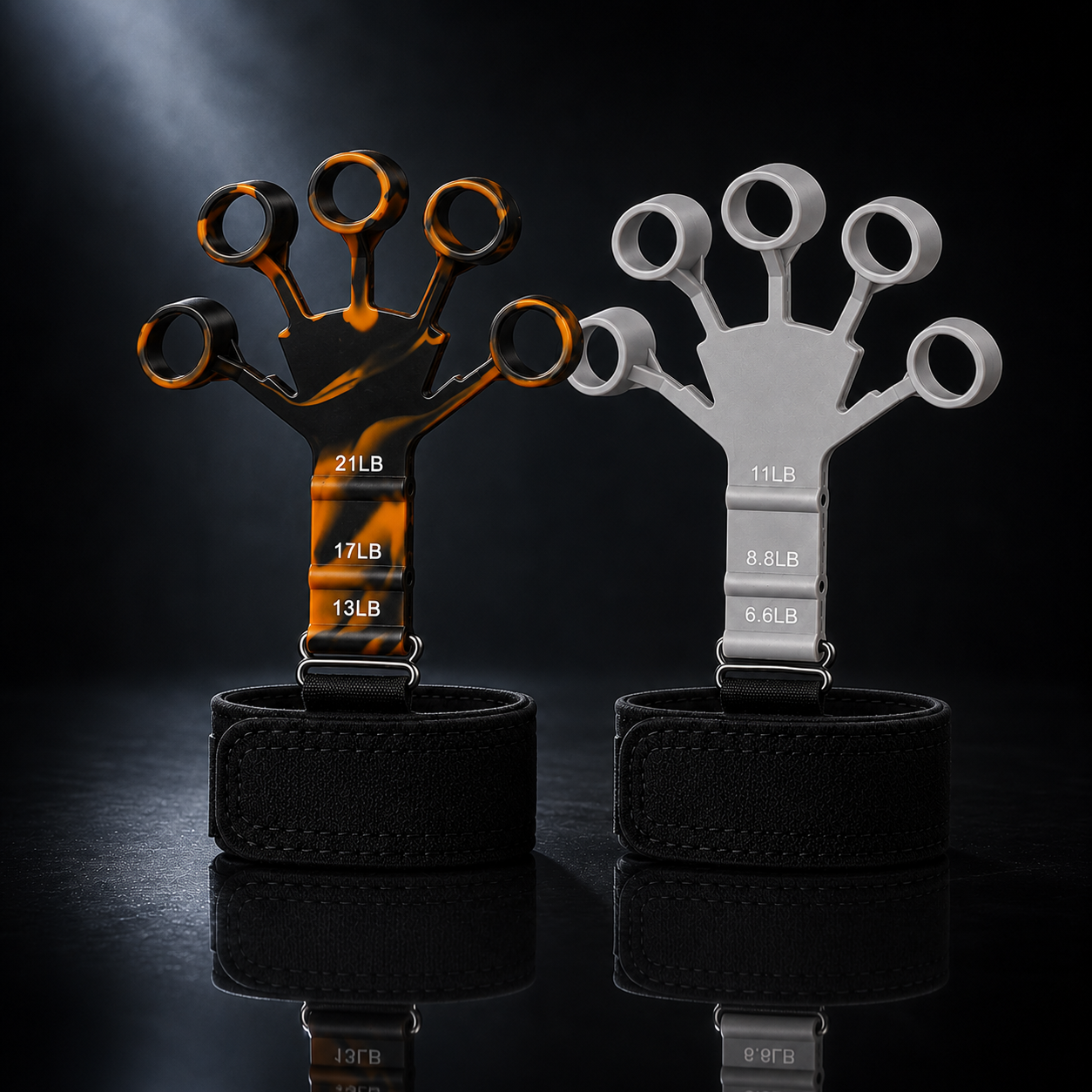 X-Grip Extensor Orange + Gray 2-pack — orange (heavy) and gray (light) finger extensor trainers