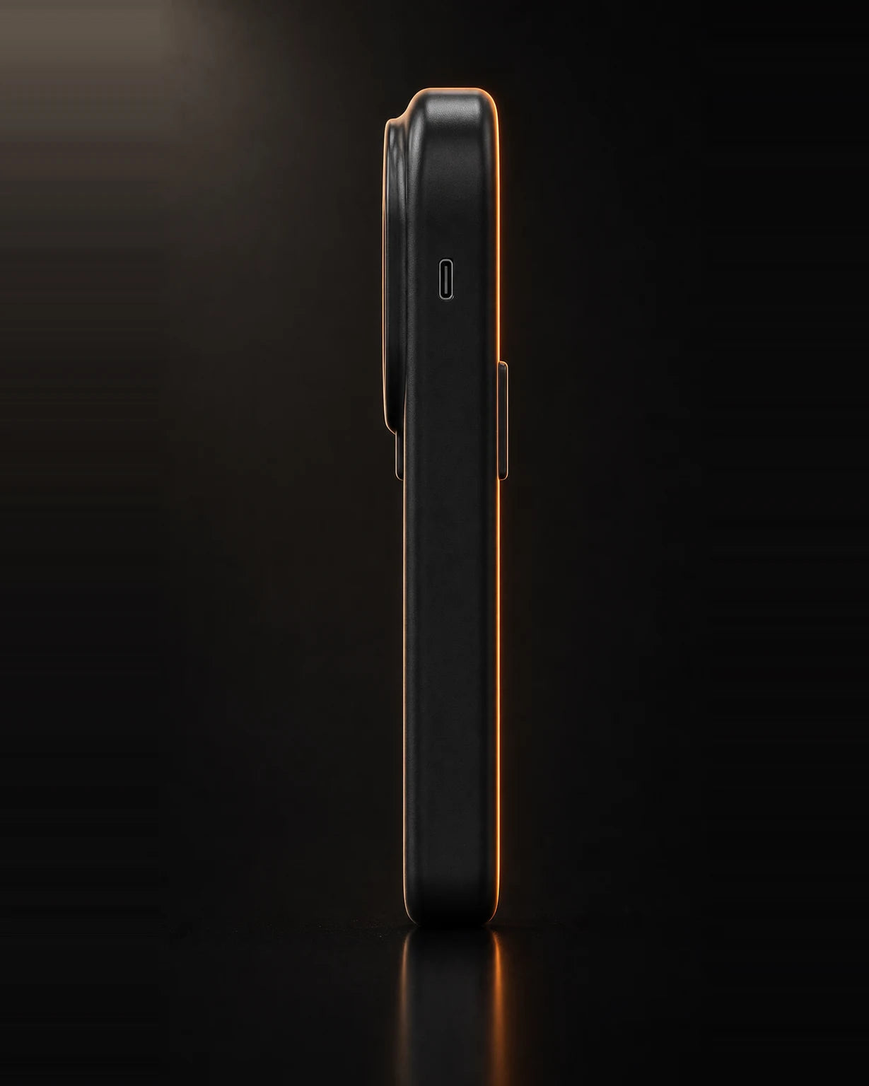 X-Grip PowerTester side profile on a dark studio background — a slim, pocketable digital hand dynamometer about 2.4 cm thick with a USB-C charging port on the edge