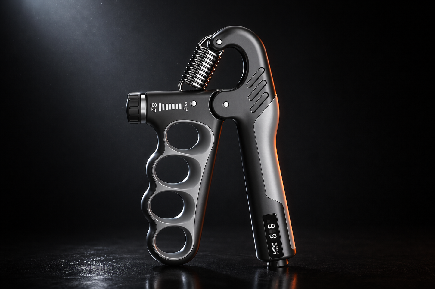 X-Grip Pro adjustable hand strengthener in gray, 5 to 100 kg dial-adjustable resistance, dark studio hero shot