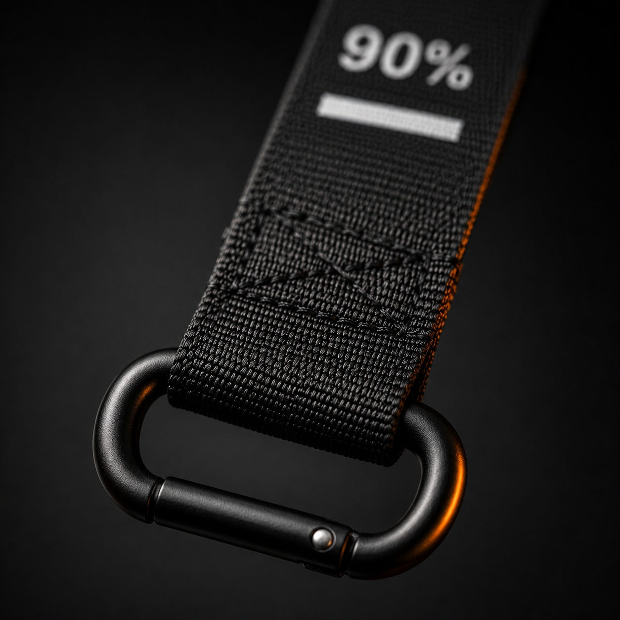 X-Grip Roller strap end close-up - 90 percent progress mark, reinforced stitching and oval spring-gate carabiner