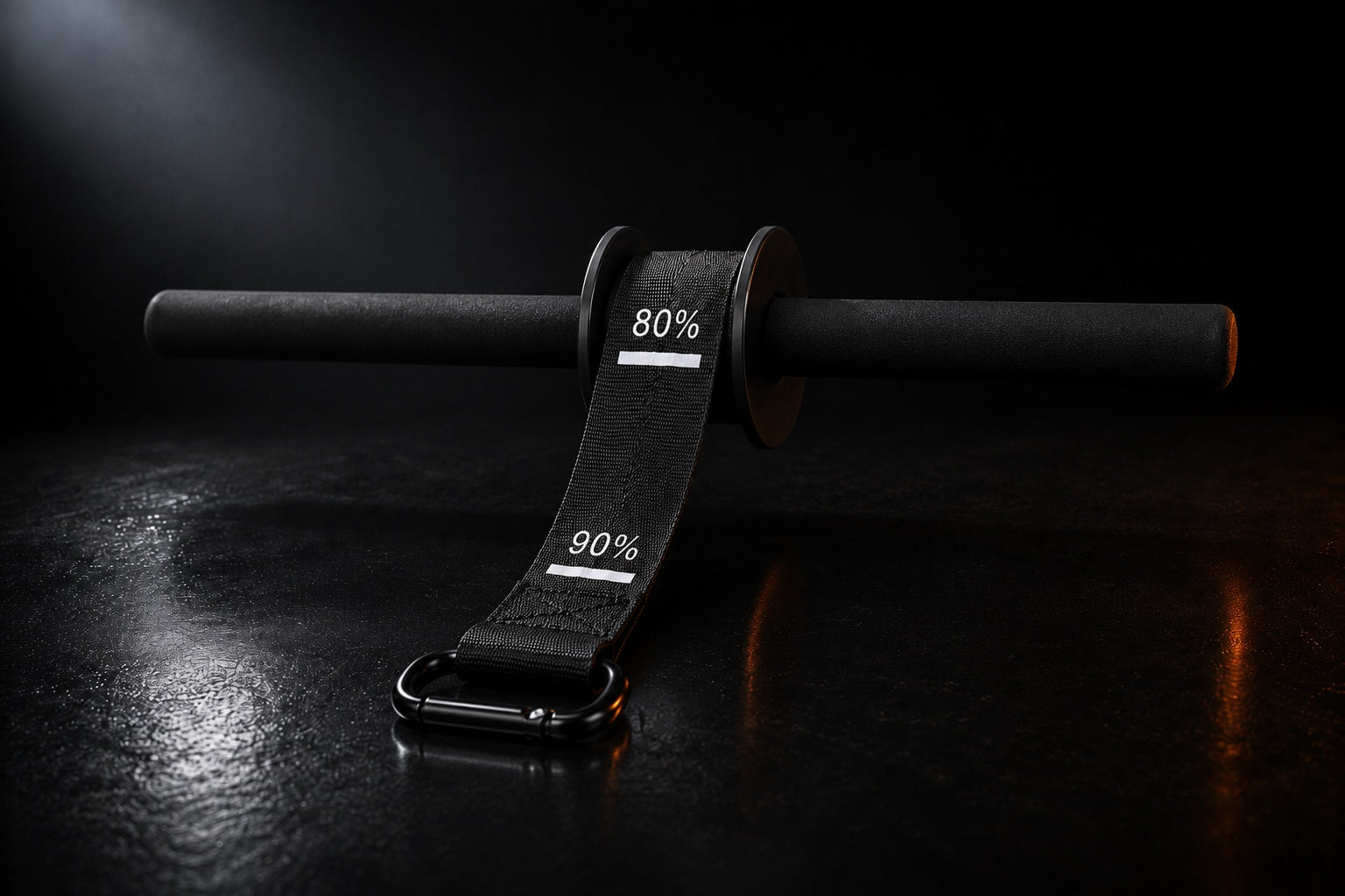 X-Grip Roller wrist roller in dark studio light - strap with progress marks and spring-gate carabiner