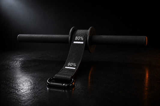 X-Grip Roller wrist roller in dark studio light - strap with progress marks and spring-gate carabiner